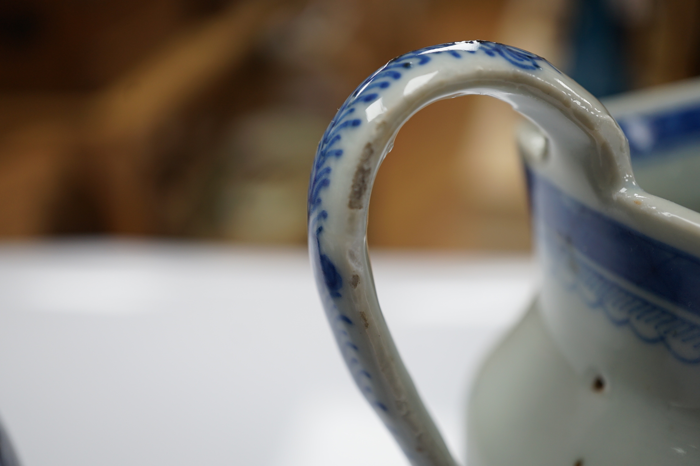 A 19th century Chinese blue and white jug, a similar jar and a pierced jar, tallest 15cm